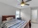 Bedroom with a double bed, nightstand, and ceiling fan at 1873 Donahue Dr, Ocoee, FL 34761