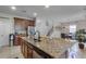 Spacious kitchen with granite countertops, island, and stainless steel appliances at 1873 Donahue Dr, Ocoee, FL 34761