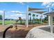 Community playground with shade structures at 1873 Donahue Dr, Ocoee, FL 34761