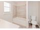 Bathroom with tub, shower, toilet and tile at 2230 Cascades Blvd # 207, Kissimmee, FL 34741