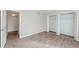 Well-lit bedroom with wood-look floors and a spacious closet at 2230 Cascades Blvd # 207, Kissimmee, FL 34741