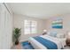 Comfortable bedroom with wood-look floors and large closet at 2230 Cascades Blvd # 207, Kissimmee, FL 34741