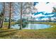 Community pond with fountain and landscaping at 2230 Cascades Blvd # 207, Kissimmee, FL 34741