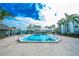 Inviting community pool with lounge chairs at 2230 Cascades Blvd # 207, Kissimmee, FL 34741