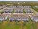 Community of townhouses, lush landscaping, and lake at 232 Rustic Loop, Sanford, FL 32771