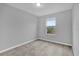 Simple bedroom with carpeted floor and window at 232 Rustic Loop, Sanford, FL 32771