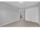 Spacious bedroom with carpet flooring and double doors to closet at 232 Rustic Loop, Sanford, FL 32771