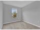 Bright bedroom with carpeted floor and large window at 232 Rustic Loop, Sanford, FL 32771