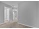 Hallway with carpet and access to bedrooms and bathroom at 232 Rustic Loop, Sanford, FL 32771