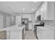 Modern kitchen with white cabinets and stainless steel appliances at 232 Rustic Loop, Sanford, FL 32771