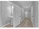 Small powder room with pedestal sink and white cabinetry at 232 Rustic Loop, Sanford, FL 32771