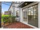 Relaxing screened patio with wood-like tile flooring at 232 Rustic Loop, Sanford, FL 32771