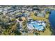 Aerial view of community pool, tennis courts, and clubhouse at 252 Wimbledon Cir # 1702, Lake Mary, FL 32746