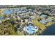 Aerial view of community pool, tennis courts, and clubhouse at 252 Wimbledon Cir # 1702, Lake Mary, FL 32746