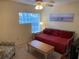 Bedroom with a daybed, ceiling fan, and view of the window at 252 Wimbledon Cir # 1702, Lake Mary, FL 32746