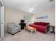 Bedroom with daybed, TV, and small sitting area at 252 Wimbledon Cir # 1702, Lake Mary, FL 32746