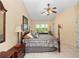 Spacious bedroom with king-size bed and access to backyard at 252 Wimbledon Cir # 1702, Lake Mary, FL 32746