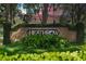 Attractive Heathrow community entrance with brick sign and landscaping at 252 Wimbledon Cir # 1702, Lake Mary, FL 32746