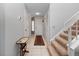 Bright entryway with tiled floor and staircase at 252 Wimbledon Cir # 1702, Lake Mary, FL 32746