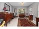 Elegant living room with dark wood furniture and area rug at 252 Wimbledon Cir # 1702, Lake Mary, FL 32746