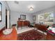 Elegant living room with dark wood furniture and area rug at 252 Wimbledon Cir # 1702, Lake Mary, FL 32746