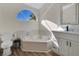 Bathroom with corner tub, white vanity, and modern fixtures at 2823 Boulder Falls Ct, Apopka, FL 32703