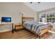 Main bedroom with wood floors and large windows at 2823 Boulder Falls Ct, Apopka, FL 32703