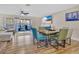 Light and airy dining area with wood flooring and sliding doors at 2823 Boulder Falls Ct, Apopka, FL 32703