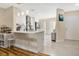 Modern kitchen with white shaker cabinets, quartz countertops, and stainless steel appliances at 2823 Boulder Falls Ct, Apopka, FL 32703