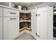 White kitchen cabinets with pull-out corner shelves at 2823 Boulder Falls Ct, Apopka, FL 32703