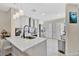 Modern kitchen with white shaker cabinets, quartz countertops, and stainless steel appliances at 2823 Boulder Falls Ct, Apopka, FL 32703