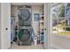 Laundry room with stacked washer and dryer, and shelving at 2823 Boulder Falls Ct, Apopka, FL 32703