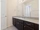 Bathroom with dark brown vanity and granite countertop at 284 Tuska Reserve Cv, Casselberry, FL 32707