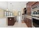 Kitchen with granite countertops, stainless steel appliances and ample cabinetry at 284 Tuska Reserve Cv, Casselberry, FL 32707