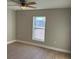 Bedroom with large window, ceiling fan, and vinyl flooring at 3 Fisher Loop Crse, Ocklawaha, FL 32179