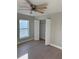 Bedroom with walk-in closet and ceiling fan at 3 Fisher Loop Crse, Ocklawaha, FL 32179