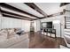 Living room with hardwood floors, exposed beams, and a neutral color palette at 3117 Eagle Blvd # C, Orlando, FL 32804