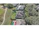 Aerial view of houses, showing landscape and backyard pools at 32604 View Haven Ln, Sorrento, FL 32776