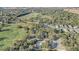 Aerial view of community pool and homes near golf course at 32604 View Haven Ln, Sorrento, FL 32776