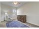 Bedroom with a recliner, rug, and a wall bed at 32604 View Haven Ln, Sorrento, FL 32776