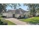 Two-story house with a three-car garage and well manicured lawn at 32604 View Haven Ln, Sorrento, FL 32776