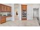 Bright kitchen with wood cabinets, stainless steel ovens, granite counters and an open layout at 32604 View Haven Ln, Sorrento, FL 32776