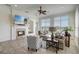 Bright living room with a fireplace, large windows, and comfortable seating area at 32604 View Haven Ln, Sorrento, FL 32776