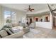 Open living area with large windows and view of kitchen at 32604 View Haven Ln, Sorrento, FL 32776