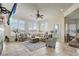 Sunlit living room with a cozy sectional sofa and large windows at 32604 View Haven Ln, Sorrento, FL 32776