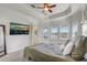 Large main bedroom with ceiling fan, TV, and view of the outside at 32604 View Haven Ln, Sorrento, FL 32776
