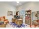Cozy home office boasts a wooden desk, comfortable leather chair, and built-in bookshelves at 32604 View Haven Ln, Sorrento, FL 32776