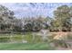 Serene pond with fountain and lush landscaping at 32604 View Haven Ln, Sorrento, FL 32776