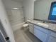 Clean bathroom with granite vanity and shower/tub at 3265 Vesara Dr, Davenport, FL 33837