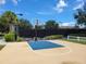 Well-lit outdoor basketball court with blacktop surface at 370 Silver Maple Rd, Groveland, FL 34736